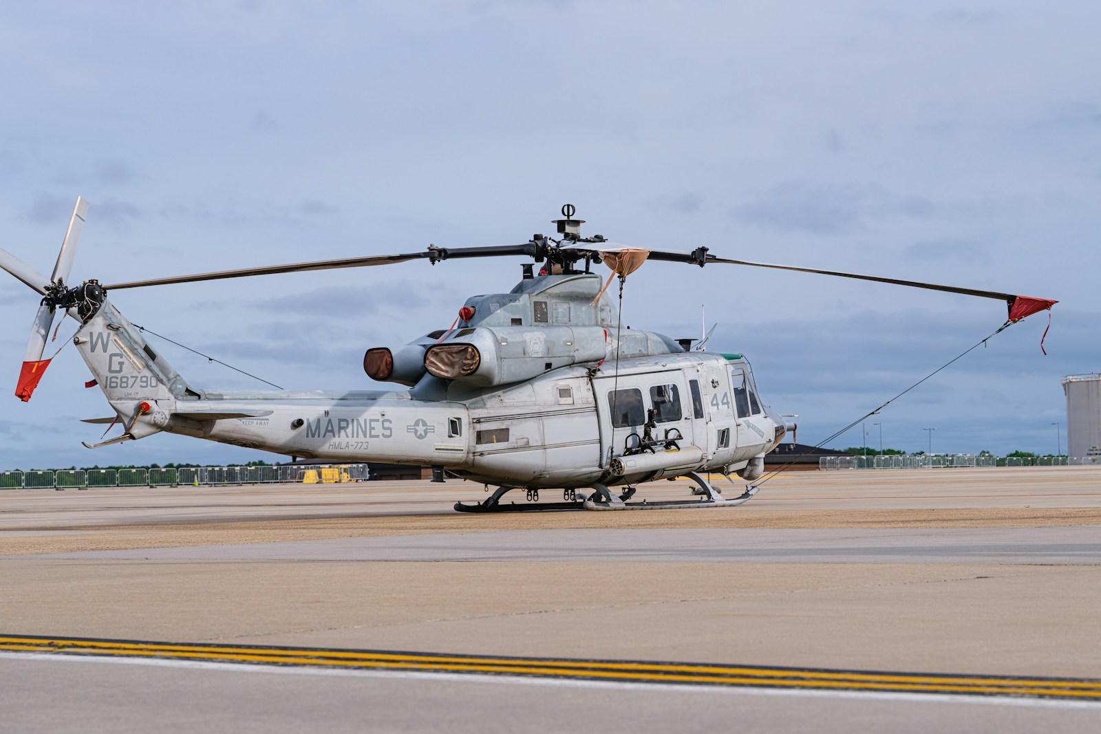 A U.S. Marine Corps Bell UH-1Y Venom helicopter assigned to HMLA-773 sits secured on the flight line at McGuire Air Force Base, New Jersey, following the 2025 Thunderbirds airshow. Date: May 19, 2025 Location: McGuire AFB, New Jersey, USA